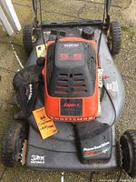 Top view of Craftsman mower showing 5.5 HP engine label, Eager-X branding, and Power Gear Drive 22 inch cutting deck.