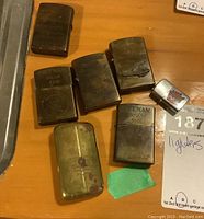 All seven lighters laid out on wooden surface