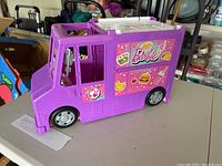 Purple Barbie food truck toy closed with visible window and decals