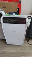 Front view of Insignia portable AC unit with control panel