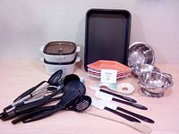 Photo showing entire lot with bakeware, serving dishes, stainless bowls and utensils