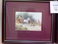 Single framed picture showing a white horse pulling a carriage with riders and hunting dogs, set against a countryside backdrop, in a dark wood frame with maroon mat.