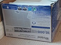 Photo of the Whirlpool 10,000 BTU window air conditioner box showing branding, product model, and specifications.