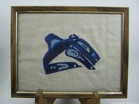 Frontal view of the framed indigenous embroidered textile design displaying the full artwork and frame.