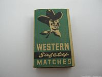 Front view of vintage Western Safety Matches box showing cowboy illustration and text.