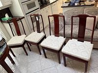 Six chairs arranged in kitchen area showing full lot and overall condition