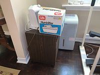 Overview of all four units positioned on floor and small stand