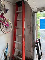 Full view of ladder standing in garage