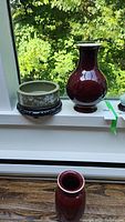 Overview of all three pottery pieces on windowsill