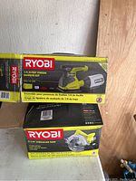 Boxed Ryobi 1/4 Sheet Finish Sander Kit and Ryobi 7-1/4 Circular Saw