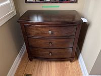Full front view of dresser showing overall shape and finish