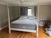 Front view of assembled bed frame with optional mattress in place