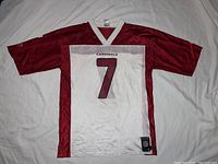 Front view of the red and white Arizona Cardinals jersey, showing large number 7 and Cardinals text above.