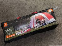 Packaged Ozark Trail 6-person dome tent showing the brand and image of tent setup outdoors with family.