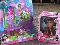 Gabby's Dollhouse Kitty Fairy's Garden Treehouse boxed playset and Makeup Artist Doll in box set on carpet.