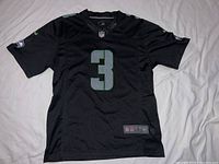 Front view of the black Seahawks NFL jersey showing number 3 and overall condition.