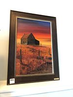 Full view of framed art print featuring old homestead house with a colorful sunset background in a dark wood frame.