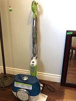 Full view of the humidifier and floor steam cleaner together with cords visible