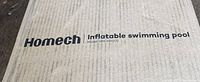 Close-up of the cardboard box with the brand name Homech and model number HM-HF002 printed on it.