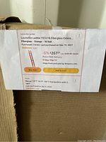 Printed Amazon listing for Louisville Ladder FE3216 fiberglass extension ladder, orange, 16 feet