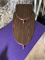 Top view of the triangle shaped retro wooden end table showing the smaller raised triangular tier above the main table surface.