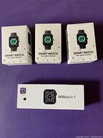 Four smartwatch boxes: three labeled 'Smart Watch Your Sports Partner', one HiWatch 7 box showing digital watch face.