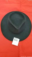 Top view of the black Akubra Stockman hat on red background