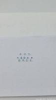 Natural diamond and aquamarine gemstones laid out on white background, showing size and clarity.