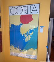 Full view of framed Corita Lincoln Center New York signed print hung on wall.