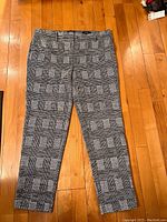 Front view of the Jones New York women's plaid dress pants showing the pattern, belt loops and ankle length cut