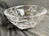 Clear crystal star patterned bowl angled side view showing star cut detailing and thickness of crystal.