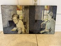 Full view of the original signed painting showing two seated figures by a window with distinct block colors in the background and visible signature.