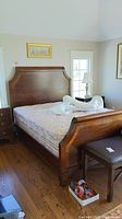 Full view of assembled bed frame with mattress and bench