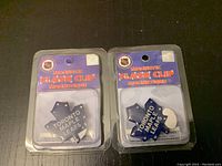 Two NHL Toronto Maple Leafs magnetic flash clips in original plastic packaging showing the Toronto Maple Leafs logo and text, with NHL branding on background cards.