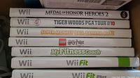 Stack of seven Wii game cases