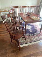 All six chairs arranged around a dining table in a room setting.