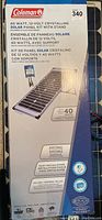Box front with Coleman branding and product details about the solar panel kit.