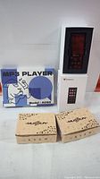 Four boxed MP3 players from two Mustrun boxes, one AO9X blue box, one white touchscreen box