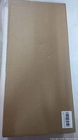 Cardboard box containing the sealed Nalanda metal detector with foldable shovel.