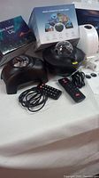 Photo shows two black Music Aurora projector lamps with clear dome lenses, two remote controls, power cords, and original packaging boxes.