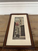 Full view of framed colored etching depicting an architectural scene with dome and tower.