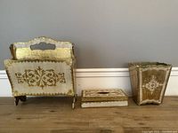 Three items in the set - magazine rack, tissue box cover, and garbage can arranged side by side on floor.