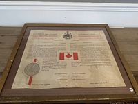 Full view of framed proclamation with visible wear and old paper texture.