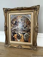 Full view of religious print in ornate gold frame, showing overall artwork and frame detail