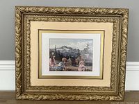 Full view of the framed print showing overall condition and decorative frame.