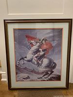 Full view of the framed print of Napoleon on horse crossing the Alps with detailed frame and matting.