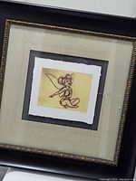 Framed lithograph showing the entire item including the frame