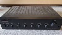 Front view of the Harman-Kardon PM640 Vxi amplifier showing front control panel with knobs and power button.