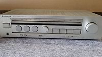 Front and top view of Kenwood KR-55 AM FM receiver amplifier showing control knobs, frequency dials and switches.