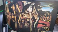 Full view of Salvador Dali 'Le Metamorphose' art print showing surreal humanoid figures and landscape.